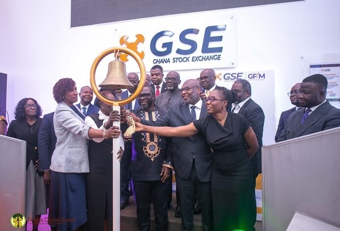 Cocoa Capital Raises----Ms Amoah (third from left) with Dr Abbey (third from right) and others tolling the GSE bell to mark the launch