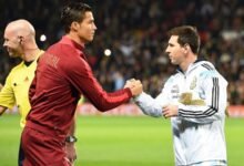 Cristiano Ronaldo and Leo Messi shake hands ahead of an international friendly