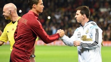 Cristiano Ronaldo and Leo Messi shake hands ahead of an international friendly