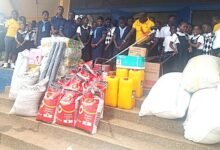 Both students from De Youngsters International School and Akropong School for the Blind with items after the donation