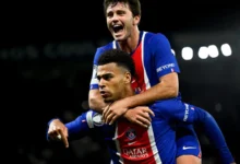 Desire Doue and Joao Neves celebrating the opening goal