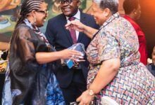 Dr Orleans-Lindsay (middle) interacting with dignitaries at the event