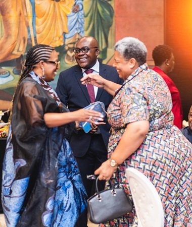 Dr Orleans-Lindsay (middle) interacting with dignitaries at the event