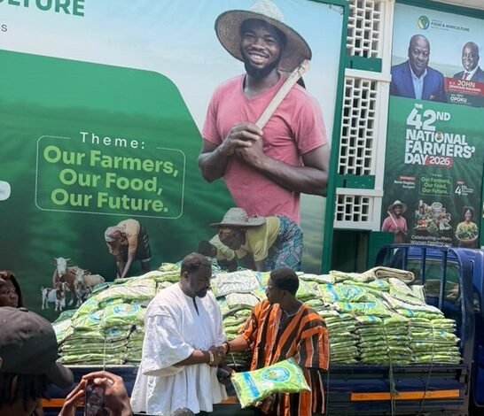 Mr Dumelo (left) receiving the items