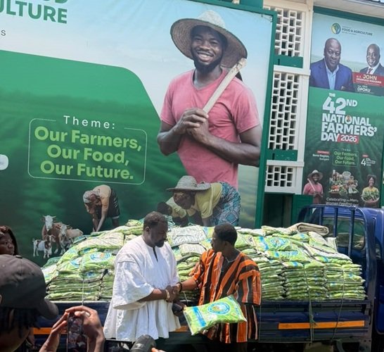 Mr Dumelo (left) receiving the items