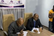 Prof Agyei-Ampomah (left), with Mr Williams (right), signing the MoU