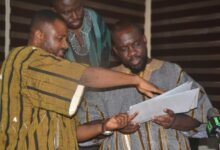 Mr Saani (left) explaining a point to Mr Totehem after presenting the petition Photo Victor A. Buxton (2)