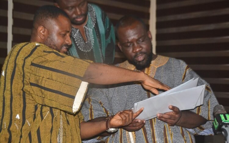 Mr Saani (left) explaining a point to Mr Totehem after presenting the petition Photo Victor A. Buxton (2)