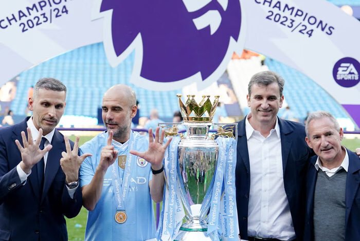 From left to right Khaldoon al-Mubarak, Pep Guardiola, Ferran Soriano and Txiki Begiristain celebrate winning the 2023-24 Premier League
