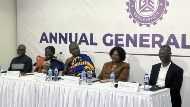 Dr Afriyie (middle) speaking at the programme. With Mrs Ofosu-Adjare (second from left) and other dignitaries at the event