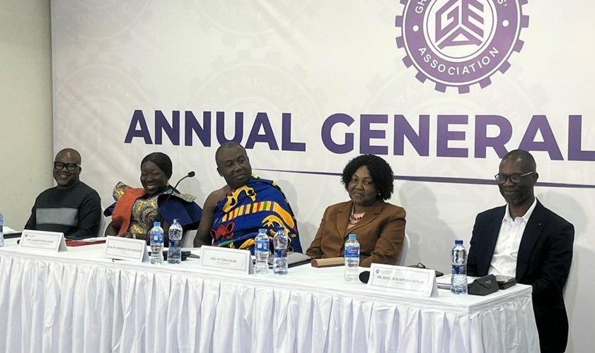 Dr Afriyie (middle) speaking at the programme. With Mrs Ofosu-Adjare (second from left) and other dignitaries at the event
