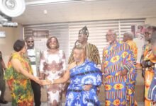 Ms Linda Ocloo (left) exchanging greetings with Ga Mantse, King Tackie Teiko Tsuru II (seated). Looking on is Ms Obuobia Darko-Opoku, Administrator, GMTF