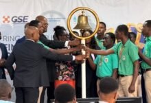 Ms Amoah (fifth from left) with other dignitaries tolling the GSE bell to launch the 2026 Financial Literacy Campaign