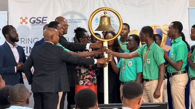 Ms Amoah (fifth from left) with other dignitaries tolling the GSE bell to launch the 2026 Financial Literacy Campaign