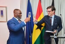 Mr Landscoft (right) and Mr Adjei proposing a toast during the reception