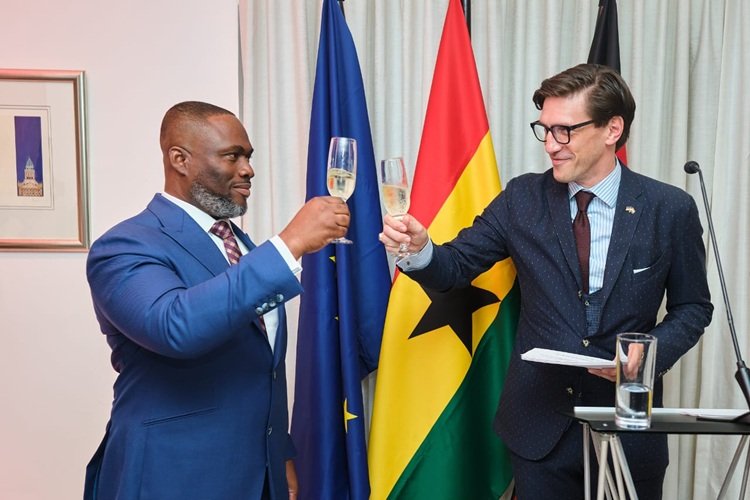 Mr Landscoft (right) and Mr Adjei proposing a toast during the reception