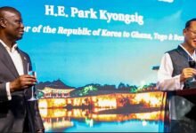 Mr Park (right) proposing a toast with Mr Buah during the programme