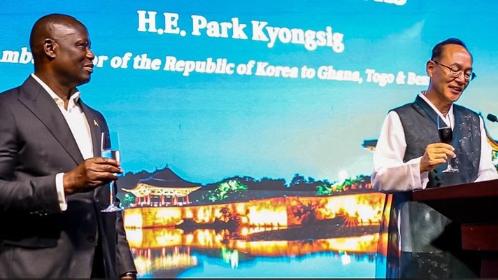 Mr Park (right) proposing a toast with Mr Buah during the programme