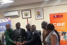 Mr Haruna Iddrisu (second from left) receiving the trophy at the event