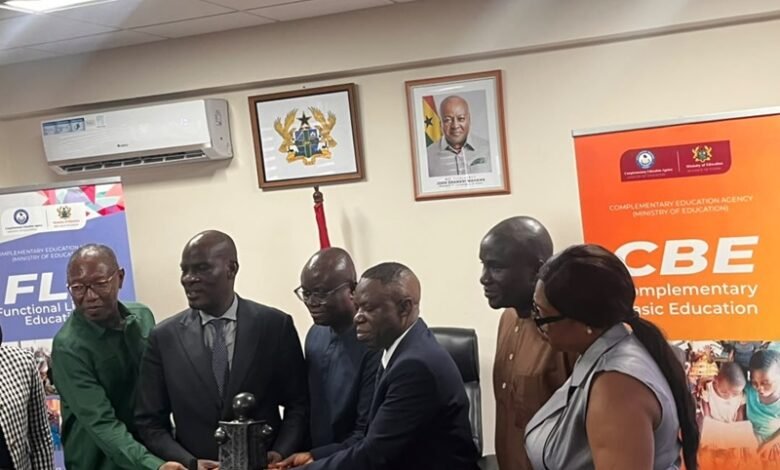 Mr Haruna Iddrisu (second from left) receiving the trophy at the event