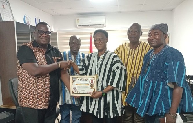 Mr Morgan Ayawine (third from right) receiving the award. With him are some ICU National leadership