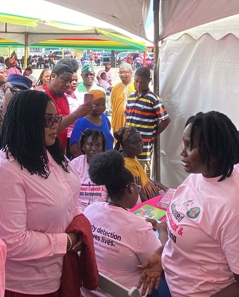Dr Lartey (left) in a discussion with a participant at the event.
