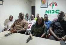 Ms Sowah (middle) speaking briefing the press after the demolition