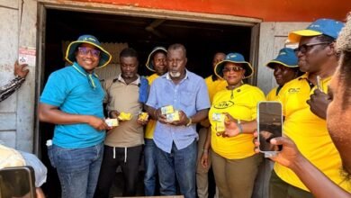MTN staff presenting a gift to a customer