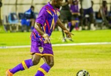 Martin Karikari controls the ball during the game