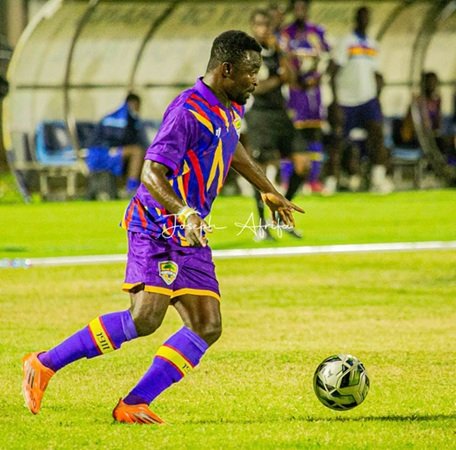 Martin Karikari controls the ball during the game
