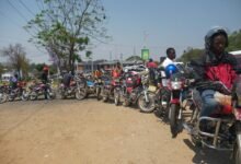Motorbike riders line up to buy fuel at petrol stations in Blantyre