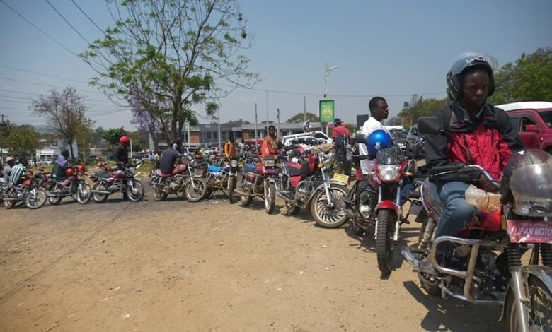 Motorbike riders line up to buy fuel at petrol stations in Blantyre