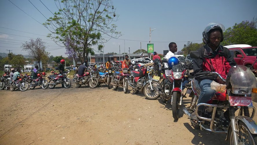 Motorbike riders line up to buy fuel at petrol stations in Blantyre