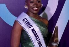 Ms Abena Amoah displaying her plaque.