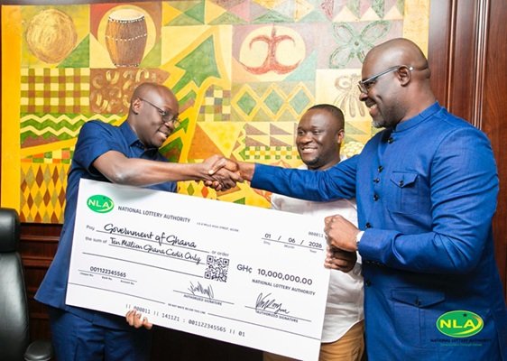 Alhaji Abdul-Salam (right) presenting the cheque to Dr Forson during the programme