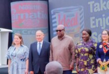 -President Mahama (third from left) with Mrs Elizabeth Ofosu-Adjare (second from right) and officials from Nestlé Ghana Limited after the visit