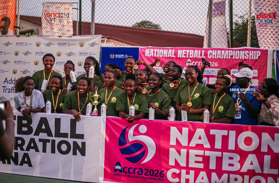 Players and officials of Hunters Hand celebrating with the trophy