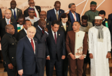President Vladimir Putin, foreground left, and other leaders pose for a family photo during the Russia-Africa Summit in Moscow