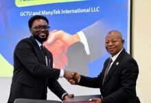 Prof Malcalm (right) with Mr Damptey exchanging the signed document