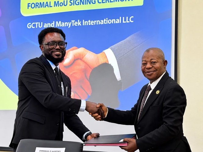 Prof Malcalm (right) with Mr Damptey exchanging the signed document