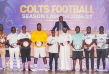 Representatives from the regions display the balls