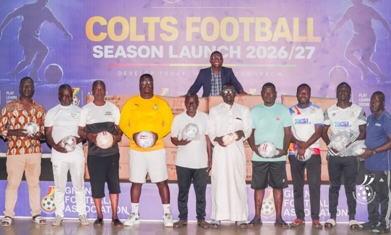 Representatives from the regions display the balls