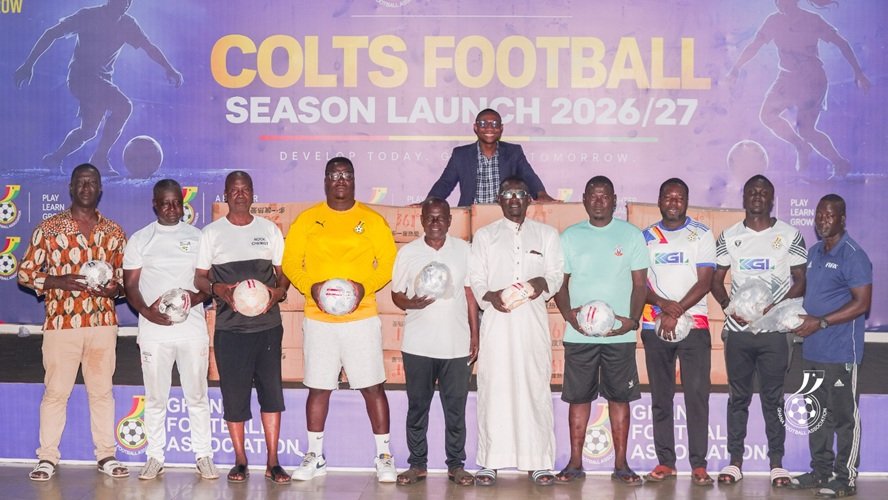 Representatives from the regions display the balls