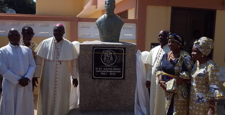 The Most Rev Fianu (right) with others after unveiling the bust of Bishop Herman