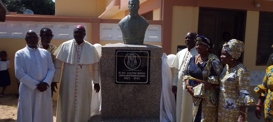 The Most Rev Fianu (right) with others after unveiling the bust of Bishop Herman
