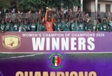 Skipper Grace Banwaa Buoadu lifts the trophy to celebrate with her teammates