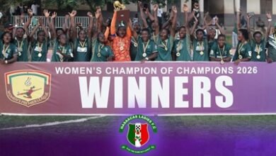 Skipper Grace Banwaa Buoadu lifts the trophy to celebrate with her teammates 