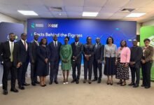 Mr Godzi (second from left) with Ms Amoah (third from left) and some senior officials of Standard Chartered Bank.