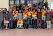 Mr Yohonu (front row middle) with Mr Oddoye (front row sixth from right) and other memers of the police and Street Sence Organisation