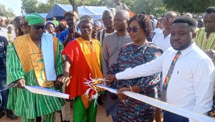 Ms Diana A. Ayamga (second from right) joined by Naba Baba Salifu (left) and other dignitaries to cut the tape to officially open the facility